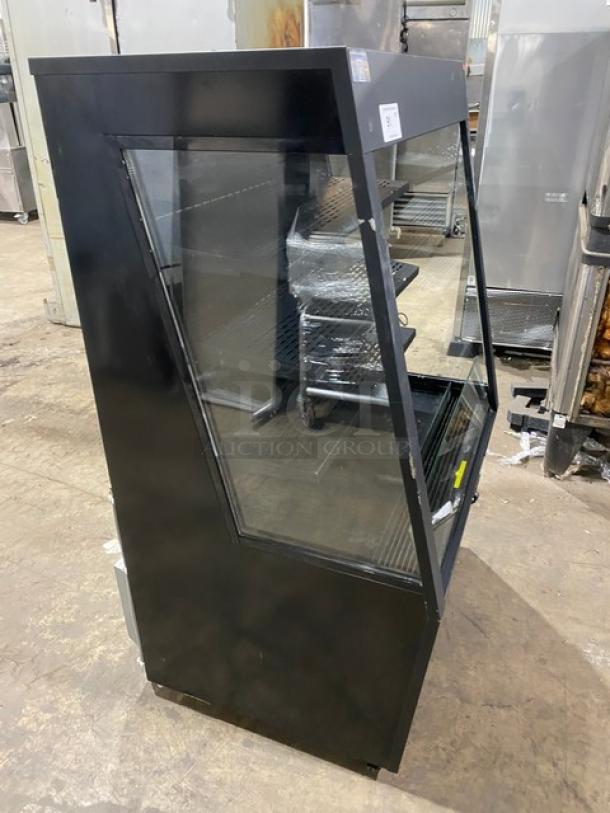 Kool-It black refrigerated merchandiser display case, model KOM-36XBK, with adjustable shelving, 110-120V, on legs.