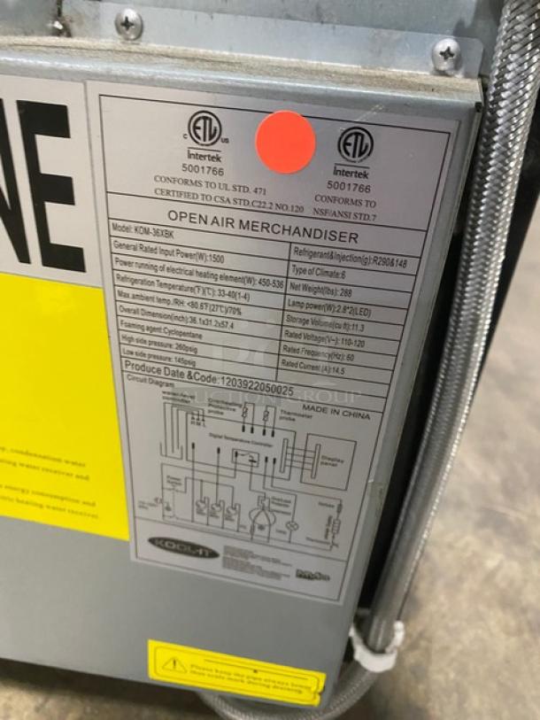 Kool-It KOM-36XBK commercial display case with adjustable shelving. Features a label with specs and model details.