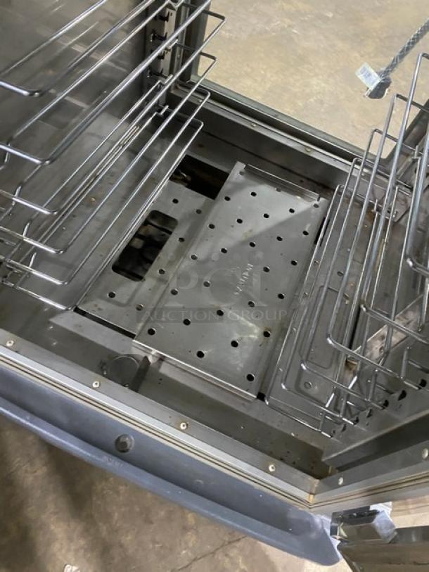 Metro C599-SDC-UPDC heated holding cabinet interior with stainless steel pan rack, on casters, in good condition.