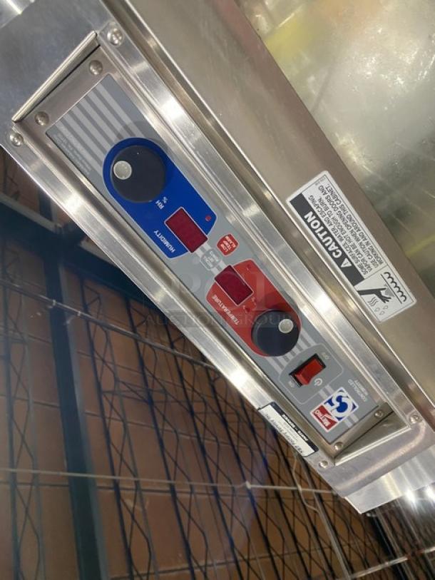 Metro commercial heated cabinet, model C599SDCUPDC, stainless steel, glass half door, pan rack, controls displayed, on casters.