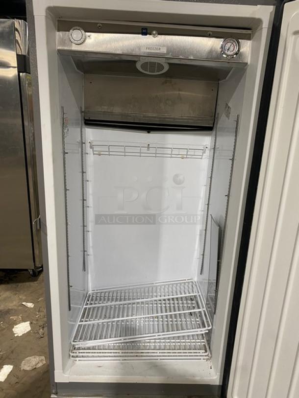 Kelvinator commercial stainless steel single door freezer, Model KFS220RHY1, Energy Star certified, with poly-coated wire rack, on casters.