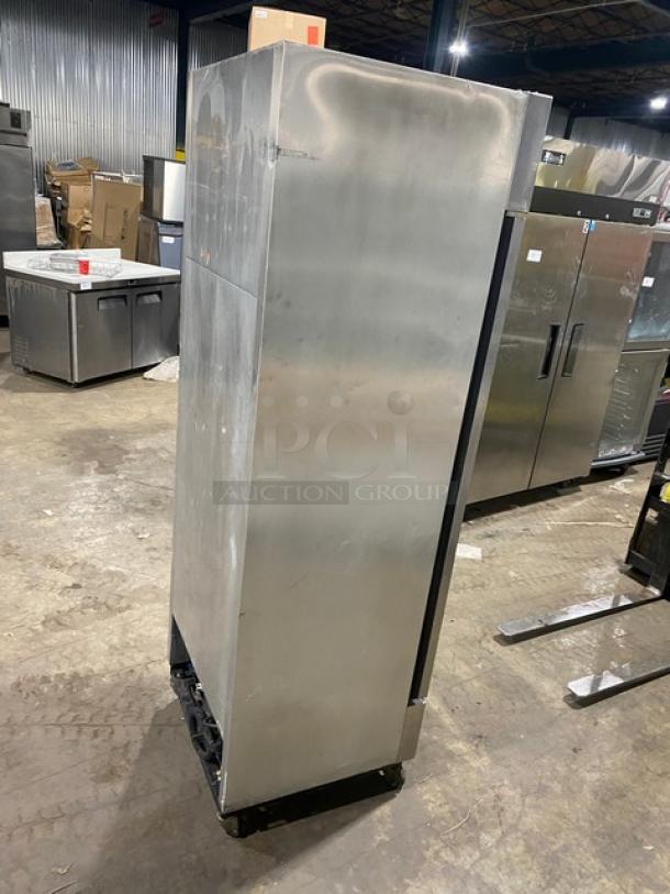 True T19FZ commercial stainless steel single door reach-in freezer on casters with poly coated wired rack, model SN 5242998.