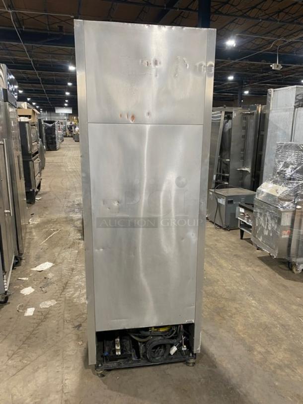 True T-19FZ stainless steel single door commercial freezer, poly-coated rack, on casters, model T-19FZ, visible dents.