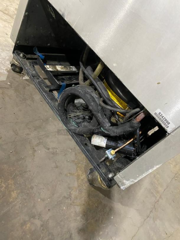 True T19FZ commercial stainless steel reach-in freezer, visible wiring, serial number 5242998, on casters, 115V 1 phase.