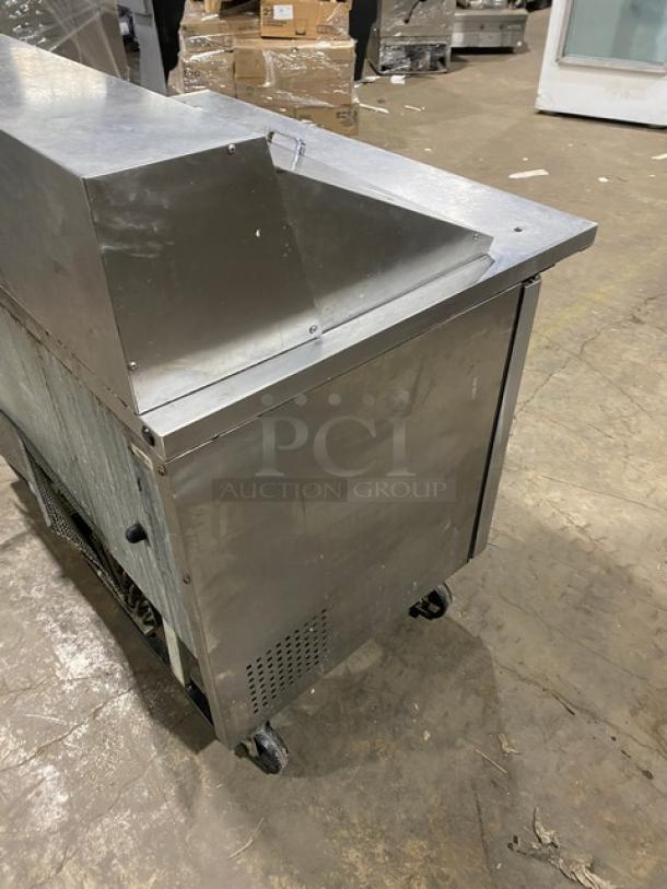 True TSSU-48-18M-B 2-Door Stainless Steel Refrigerated Prep Table, on casters, with poly coated rack, commercial use.