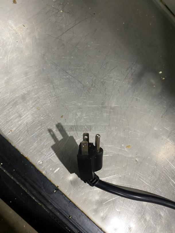 True Commercial Stainless Steel 2-Door Refrigerated Prep Table, Model TSSU-48-18M-B, on casters, shown with power plug.