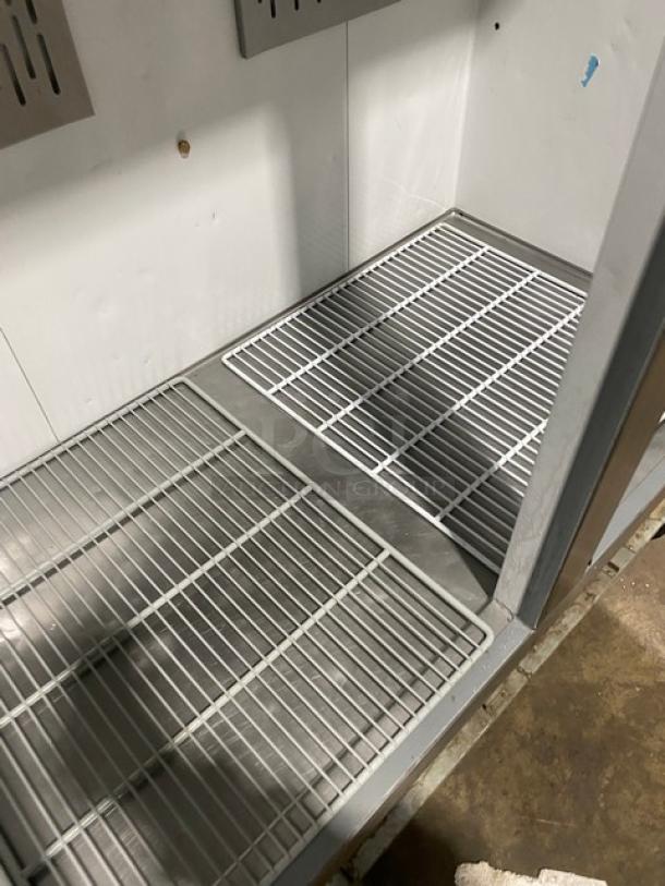 Economy EF2 stainless steel 2-door reach-in freezer, Energy Star certified, with poly coated wired racks, on casters.