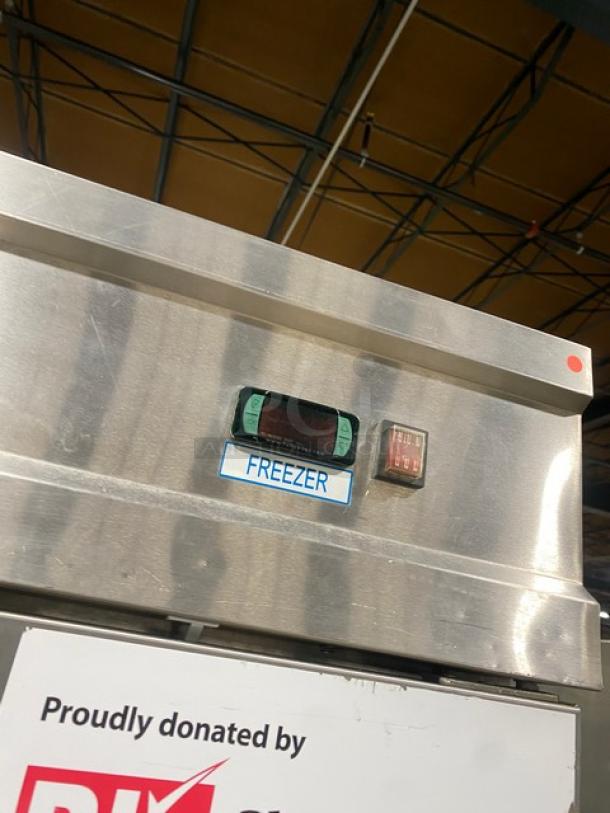 Economy EF2 stainless steel 2-door reach-in freezer, Energy Star certified, with poly-coated wired rack. Model EF2, 115V, on casters.
