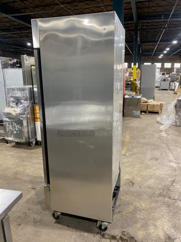 True T-23F-2 commercial stainless steel reach-in freezer, single section, half door, poly-coated rack, on casters.