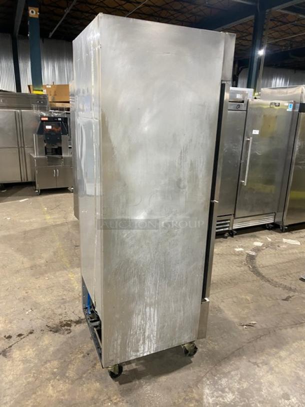 True T-23F-2 stainless steel half door reach-in freezer, poly coated rack, on casters, model T23F2, 115V, used.