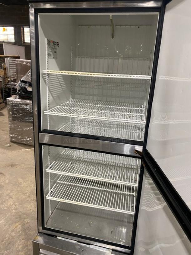 True T-23F-2 commercial stainless steel half door reach-in freezer with poly-coated wire racks, on casters, 115V.