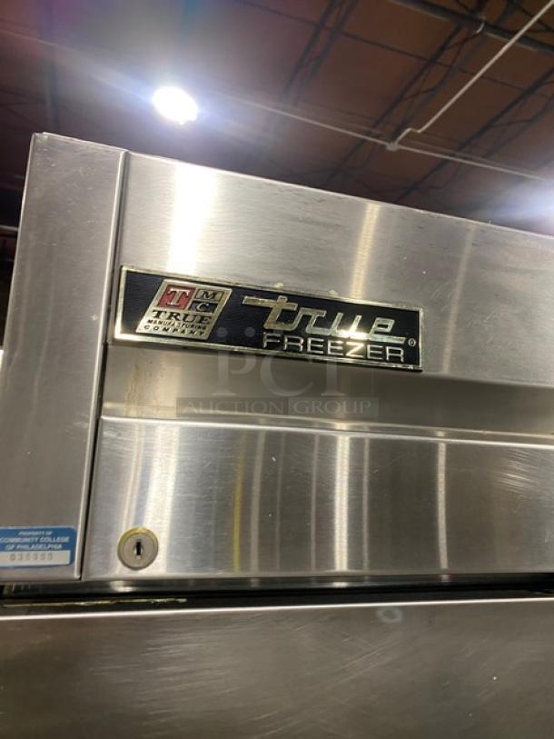 True T-23F-2 commercial stainless steel reach-in freezer, single section, solid half door, on casters, poly coated rack.