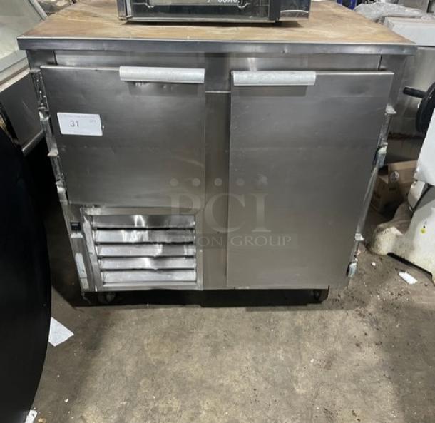 Leader DR48SC stainless steel 2-door refrigerated pizza dough retarder table on casters. Model: DR48SC, 115V, 1 phase.