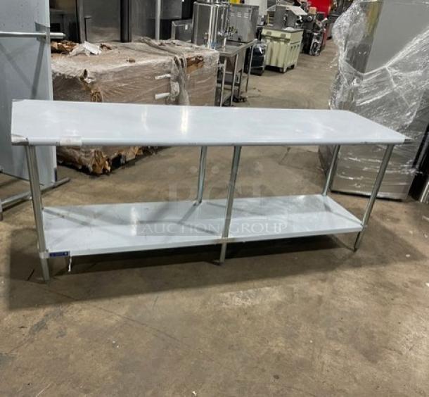 L&J Commercial stainless steel single undershelf worktop table, new condition, minor cosmetic scratches, on sturdy legs.