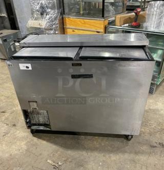 Perlick FR48SS commercial stainless steel double section back bar cooler, double sliding lids, chrome rack, on casters.