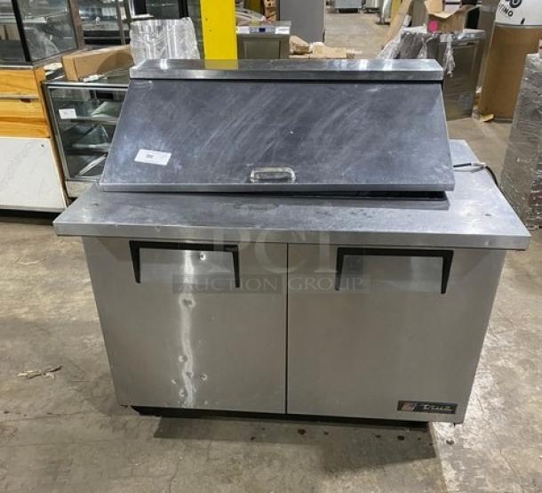 True TSSU-48-18M-B stainless steel 2-door refrigerated prep table, Bain Marie style, on casters with poly-coated rack.