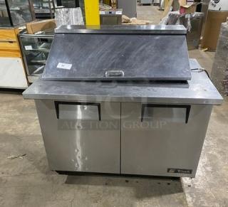True TSSU-48-18M-B stainless steel 2-door refrigerated prep table, Bain Marie style, on casters with poly-coated rack.