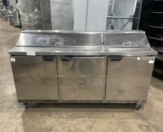 Beverage-Air Elite Series stainless steel 3-door refrigerated salad/sandwich prep table, model SPE72-18, on casters.