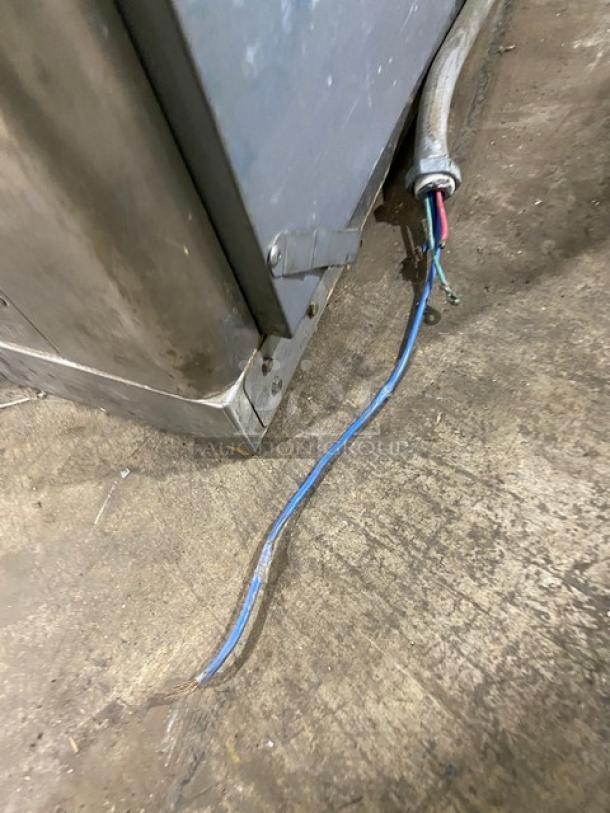 Alto-Shaam stainless steel electric countertop rotisserie oven with digital controls, visible wiring, slightly worn condition.