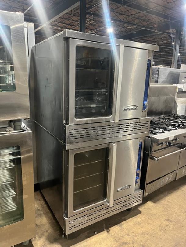Imperial stainless steel double-stacked convection oven on casters, natural gas powered, includes wired oven rack.