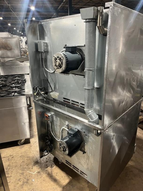 Imperial commercial stainless steel double-stacked convection oven, natural gas powered, with wired rack and on casters.