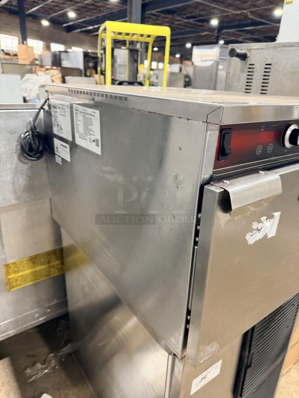 FWE Handy Line stainless steel countertop heated holding cabinet, model HLC18263CHP, 2019. Electric, 3-pan, 120V. Good condition.