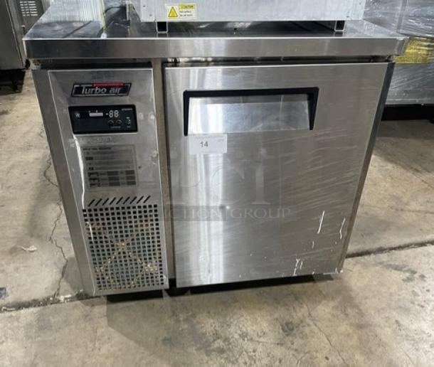 Turbo Air J Series stainless steel 1-door undercounter refrigerator, model JUR-36, on casters, with visible control panel and logo.