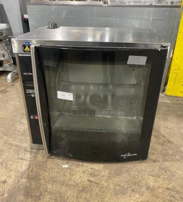 Alto-Shaam stainless steel electric countertop rotisserie oven with digital controls, visible labels, slightly used condition.