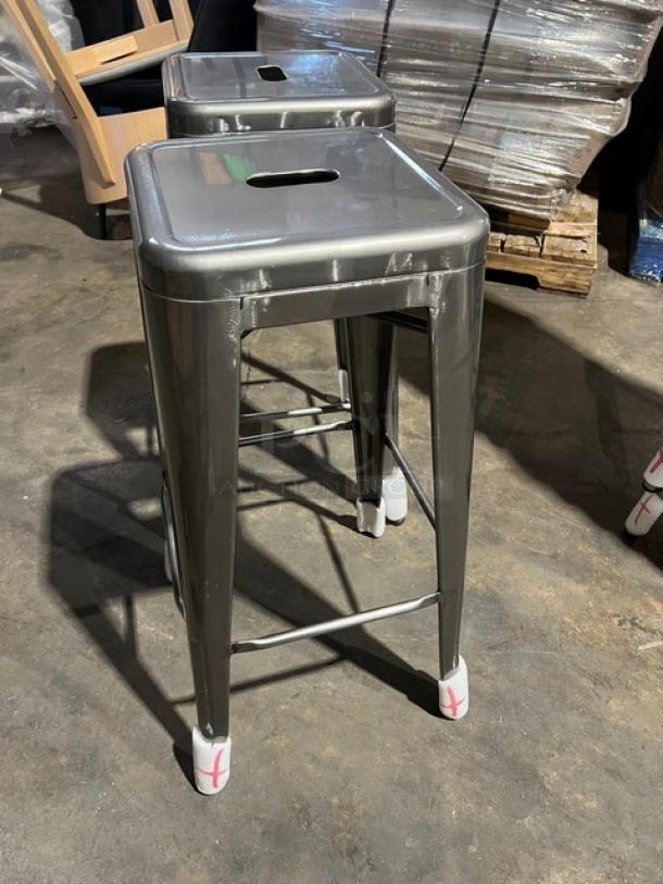 Brand new gray gunmetal backless stackable bar-height stool in industrial style, commercial quality.