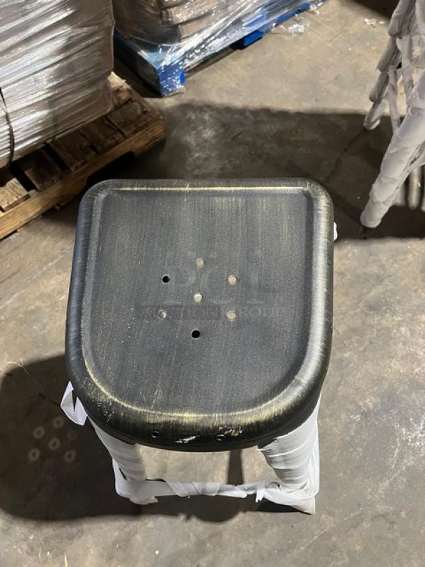 Commercial black/antique gold distressed bar-height stool, backless, stackable, brand new condition, industrial style.