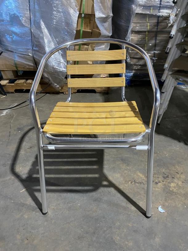 Brand new aluminum stackable dining/patio chair with faux teak slat back and seat, suitable for indoor/outdoor use.