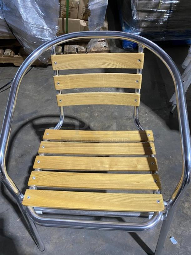 Brand new aluminum stackable dining/patio chair with faux teak slat back and seat, suitable for indoor/outdoor use.