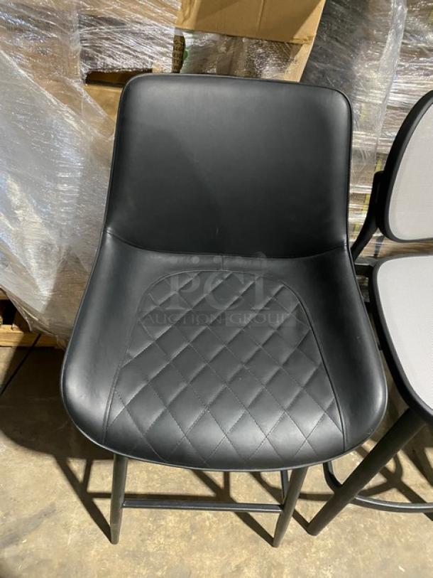 Brand new modern bar-height dining chair with black leather upholstery and diamond stitching. Perfect condition.