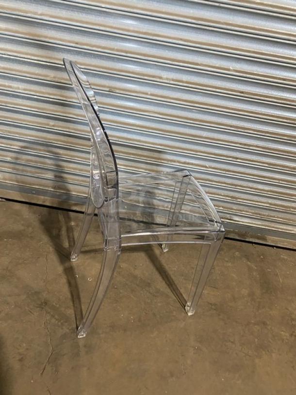 Transparent stackable ghost-style chair, new condition. Suitable for indoor/outdoor use. Modern design, ideal for dining/patio.