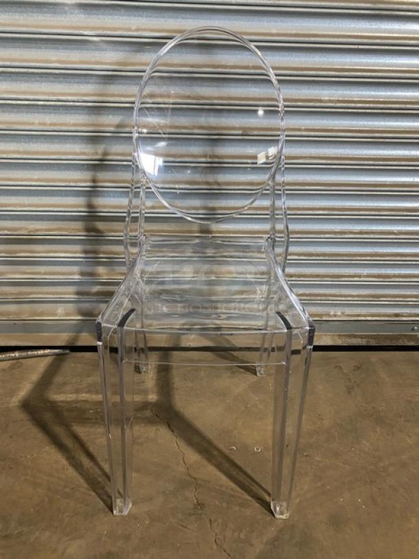 Brand new commercial clear ghost style transparent stackable dining/patio chair for indoor/outdoor use.