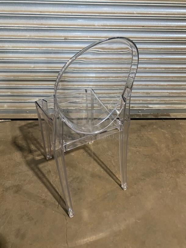 Brand new transparent stackable ghost-style dining chair, suitable for indoor/outdoor use. Durable and modern design.