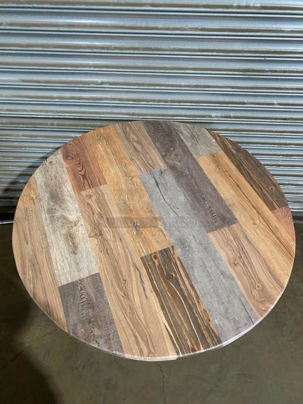 Brand new rustic round wooden dining table with a 4-leg pedestal base, multitone wood finish.