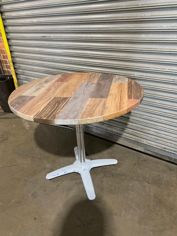 Brand new rustic wooden round dining table with a 4-leg pedestal base. Durable construction, commercial quality.