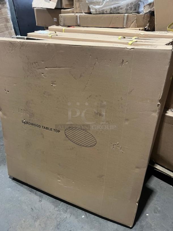 Brand new DuroWood DW-42 round dining table in box. Features a 42" top and 4-way pedestal base. Durable and modern.