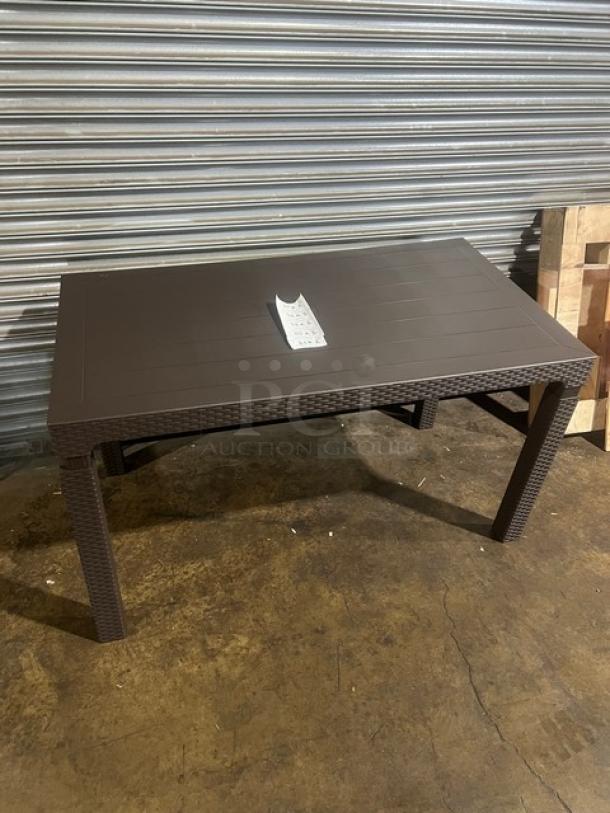 Brand new Rainbow Arizona 140"x80" brown faux wood outdoor table with rattan-textured finish and sturdy legs.