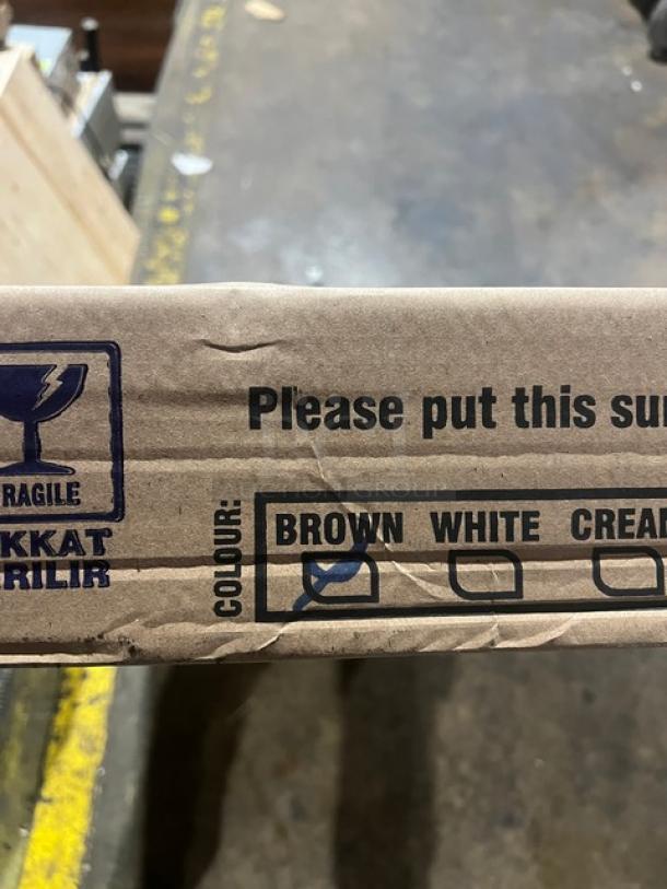 Cardboard box labeled "Brown" indicating the color of a Rainbow Arizona Collection outdoor table. Marked as fragile.