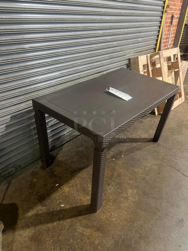 Brand new Rainbow Arizona 140"x80" rectangular outdoor table, brown polypropylene faux wood slats, rattan finish.