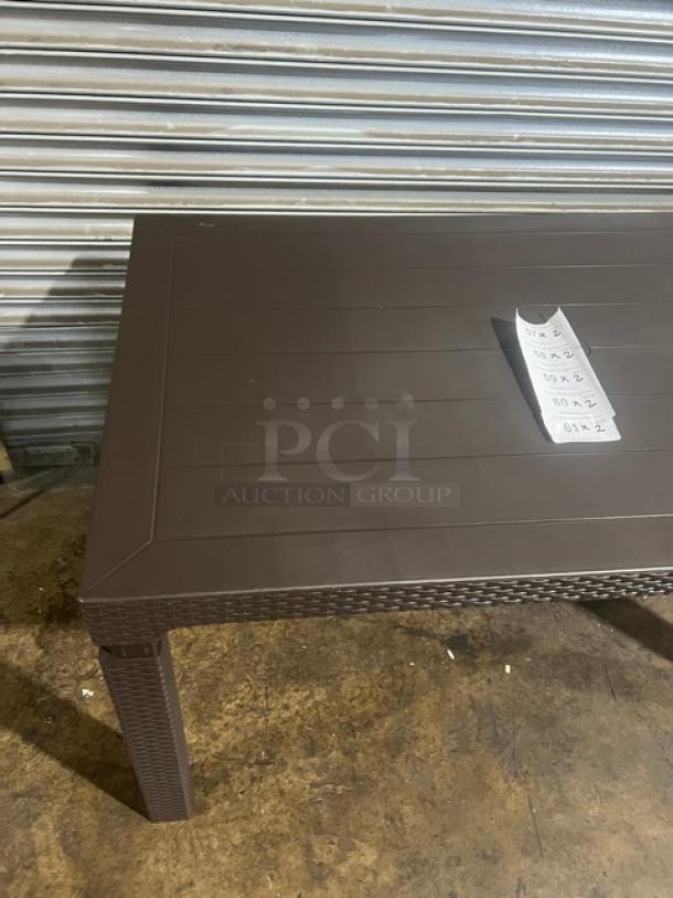 Brand new Rainbow Arizona Collection brown polypropylene faux wood outdoor table, 140"x80", rattan texture, rectangular.
