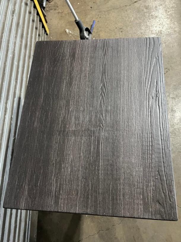 Brand new DuroWood DW-2430 dining table, 24"x30", dark wood grain, rectangular top, 4-way pedestal base, durable design.