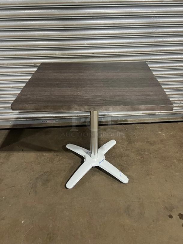 Brand new DuroWood 24"x30" dining table, model DW2430. Features a durable dark wood top and 4-way pedestal base.