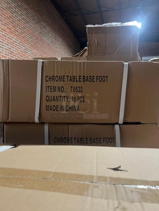 Boxes labeled "CHROME TABLE BASE FOOT, ITEM NO: T0522, QUANTITY: 10 PCS, MADE IN CHINA," stacked in a warehouse.