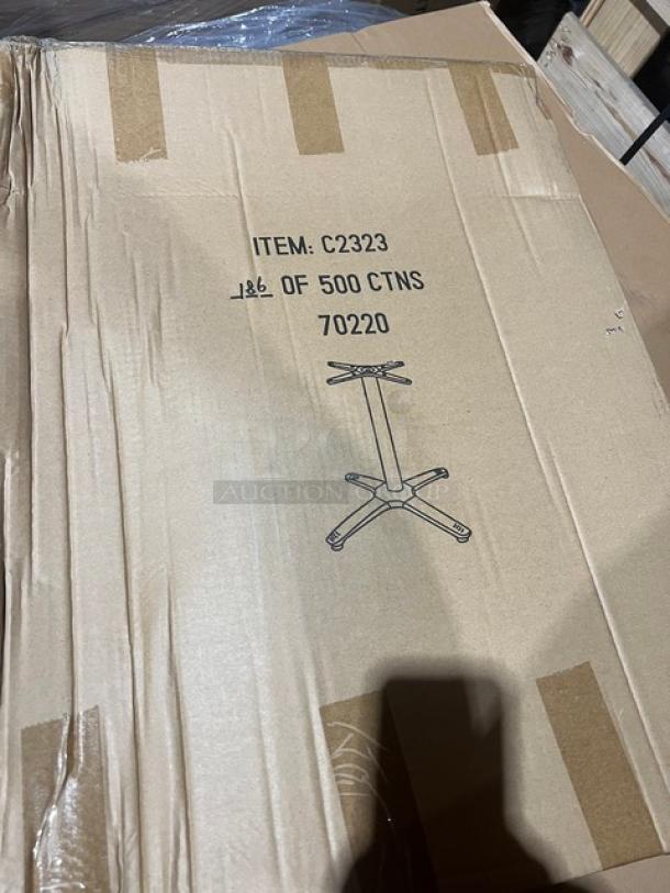 Cardboard box labeled with an illustration of a pedestal table base. Markings read "ITEM: C2323," "186 OF 500 CTNS," "70220."