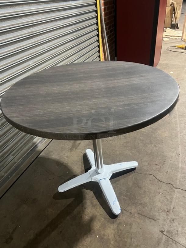 Brand new DuroWood 36" round dining table, model DW36, with durable top and 4-way pedestal base.