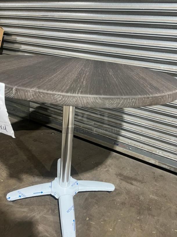 Brand new DuroWood 36" round dining table, model DW36, with a 4-way pedestal base. Durable commercial design.