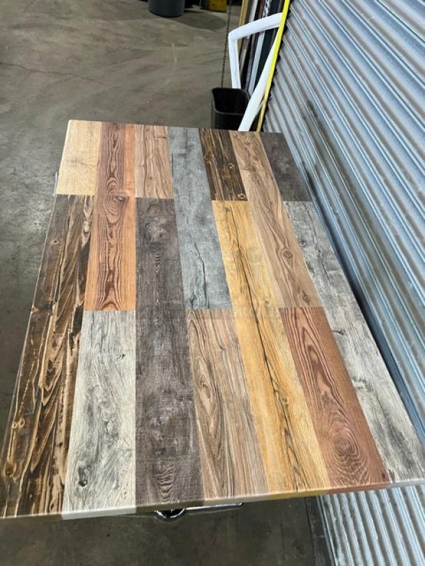 Brand new DuroWood dining table with rustic barn wood plank top and chrome plated T-style base, rectangular shape.